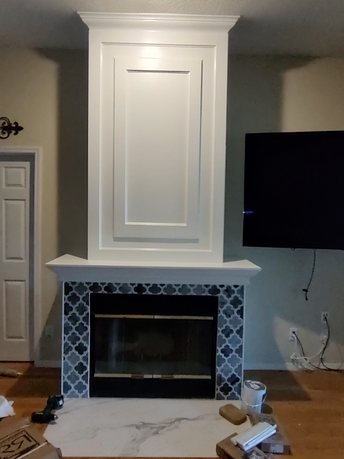 Finished Tampa fireplace with arabesque tile surround and painted mantel