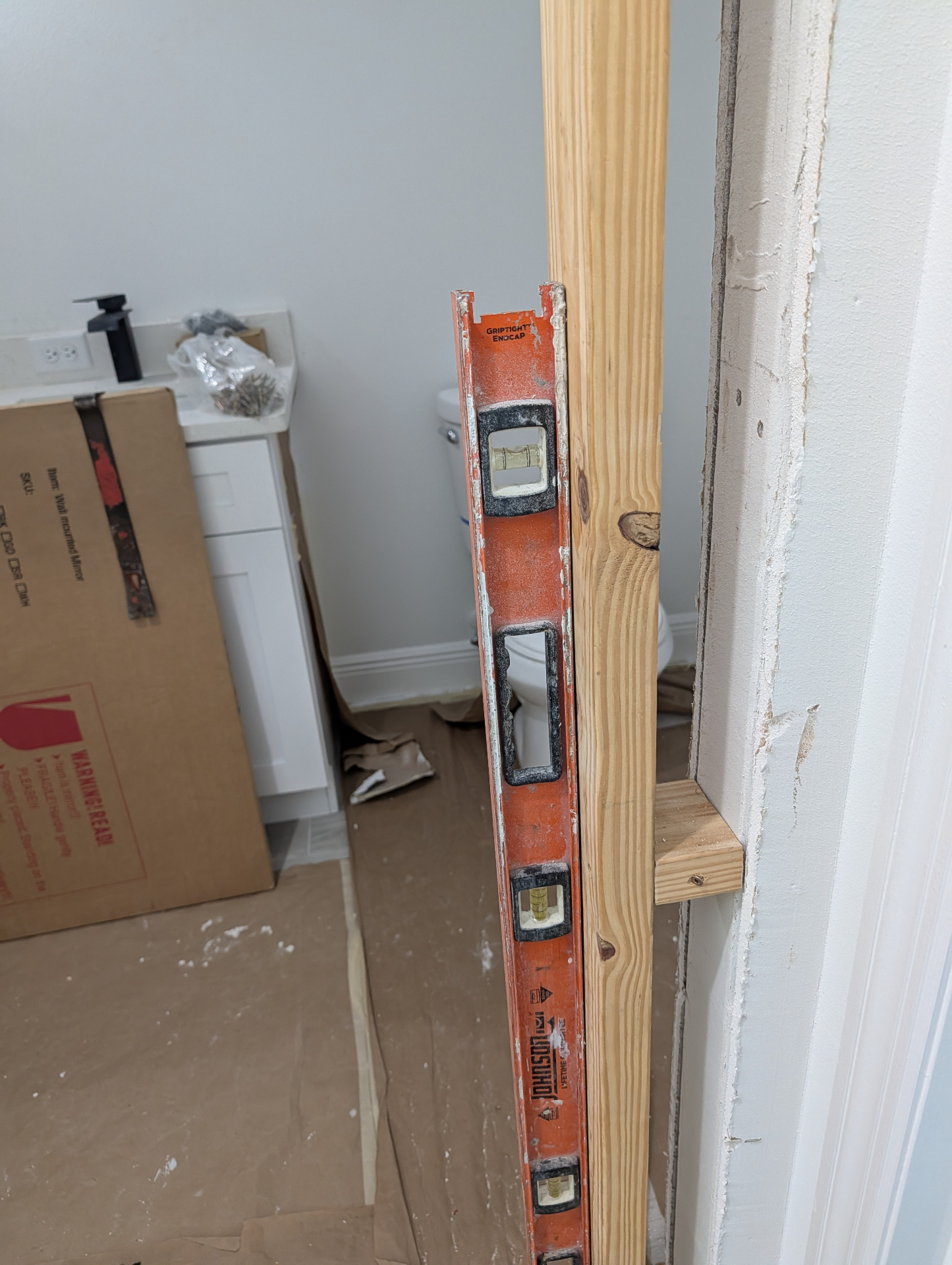 Drywall and door framing repair in progress on a Tampa bathroom remodel