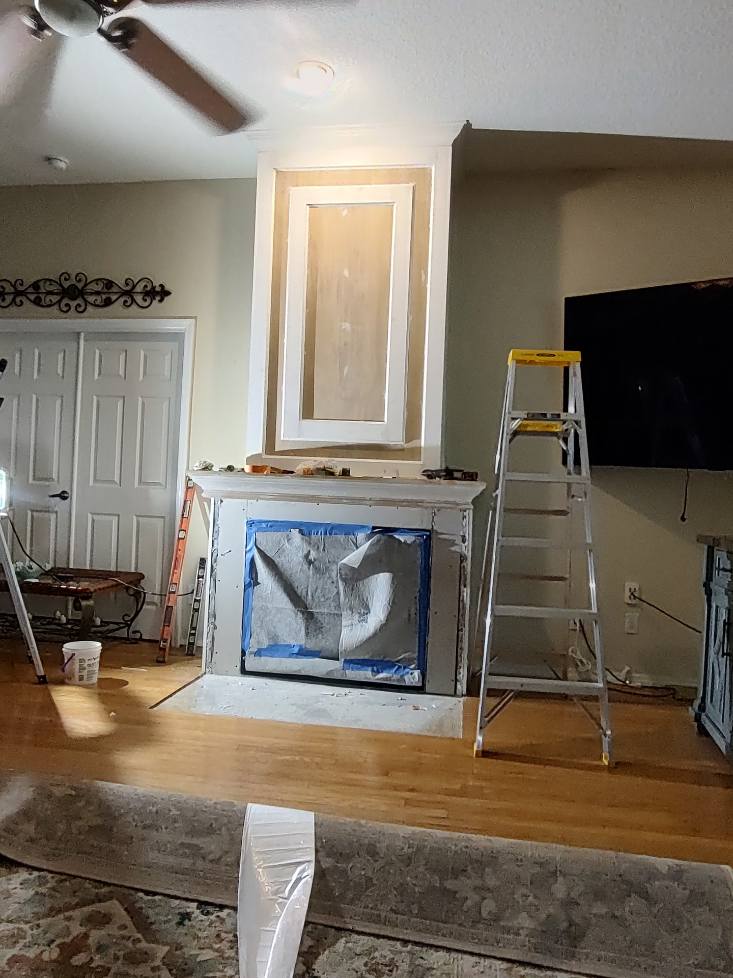 Tampa fireplace makeover in progress β masked off and prepped for tile and paint